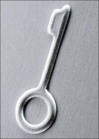 Rubbelfest: Jungs Lichtschalter-Klassiker LS 990 mit geprägten Symbolen